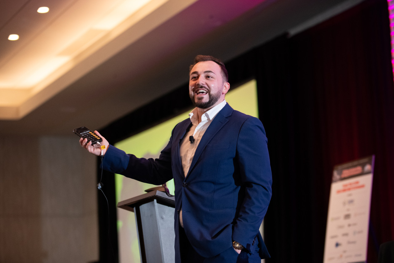 Chris Michael delivering live behavioral intelligence training on stage
